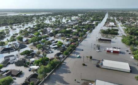 Abandoned vehicles litter flooded streets after over a half year’s worth of rain forces water rescues in parts of South Texas
